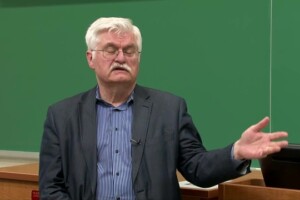 Jan Fedoriwicz standing in front of blackboard