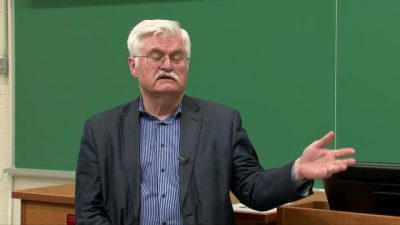 Jan Fedoriwicz standing in front of blackboard