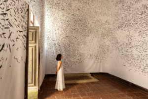 photo of woman in white dress along in a room