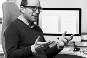 Paul Nelles sitting at computer desk