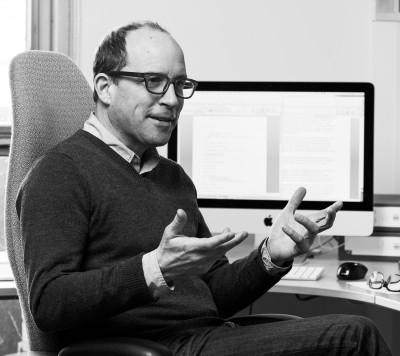 Paul Nelles sitting at computer desk