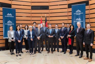 program participants standing up against a wall