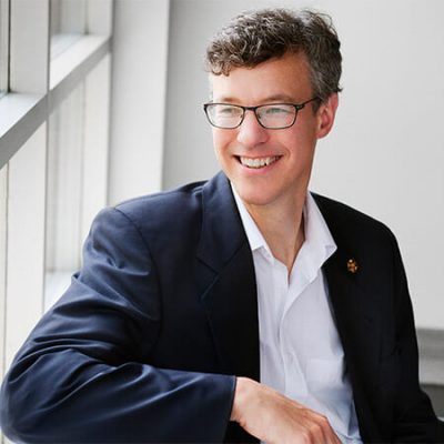 smiling photo of David Webster sitting down