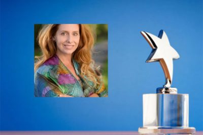 Jennifer Evans portrait with award in background