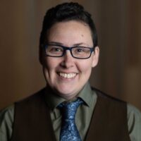 Round thumbnail photo of Benny Michaud (She/He/They) - ON LEAVE Profile photo of Benny Michaud (She/He/They) - ON LEAVE