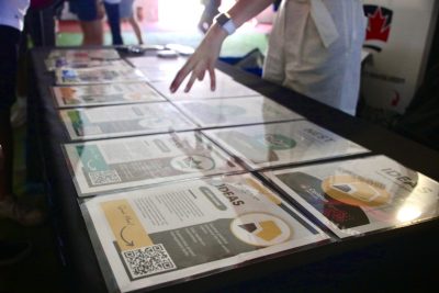 Wide shot of a table with flyers about the Innovation Hub's programs. 