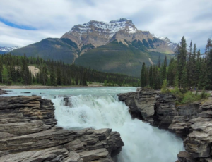 Waterfall with mountain in the background