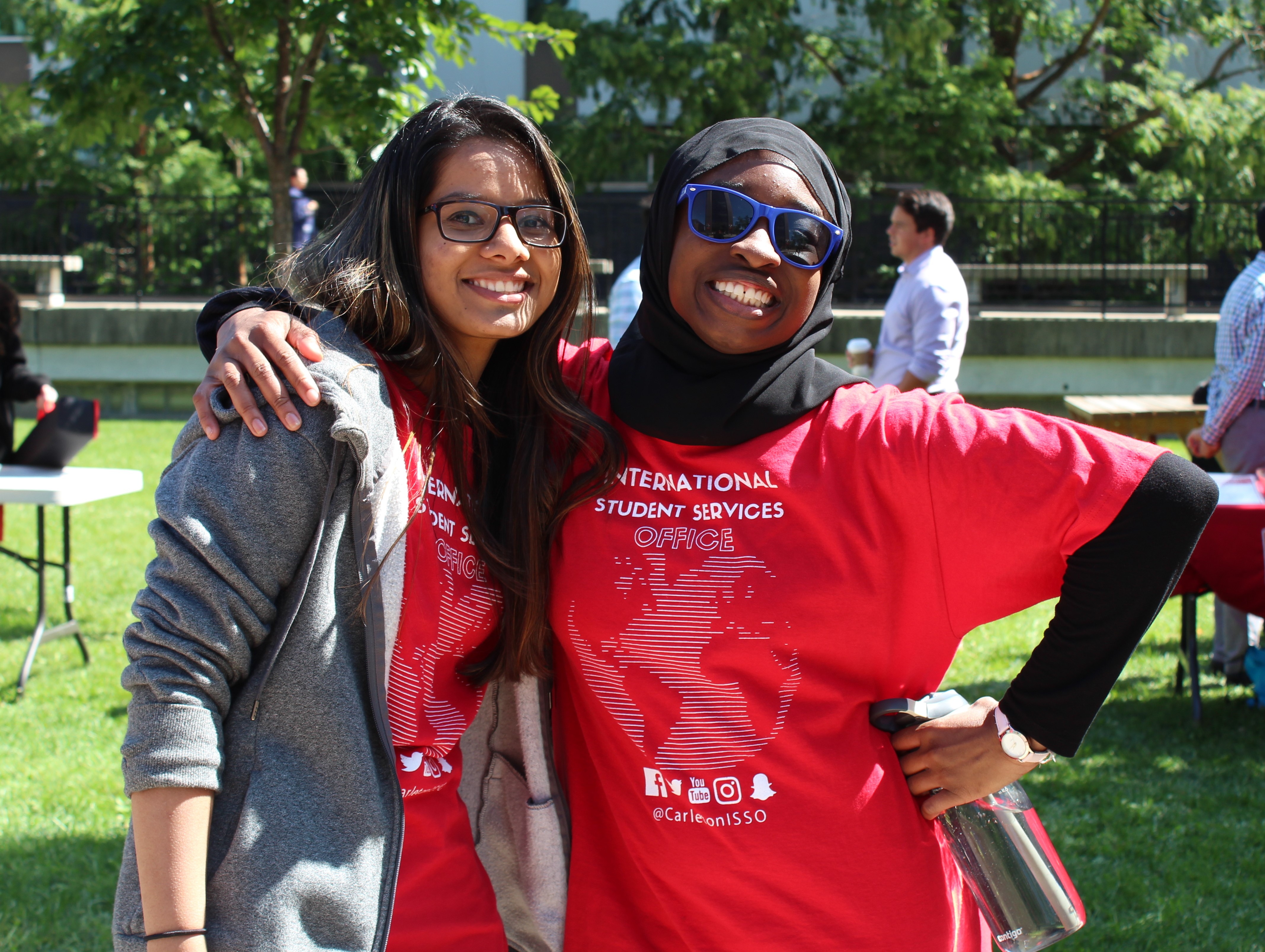 Two smiling female student volunteers