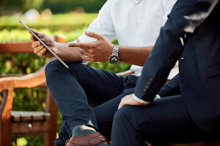 Two business people having a meeting in the park