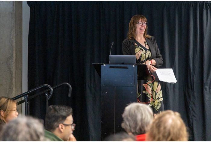 CIO Valerie Turner speaks at a podium.