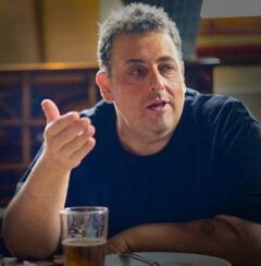 Peter Hirsch sitting at a table