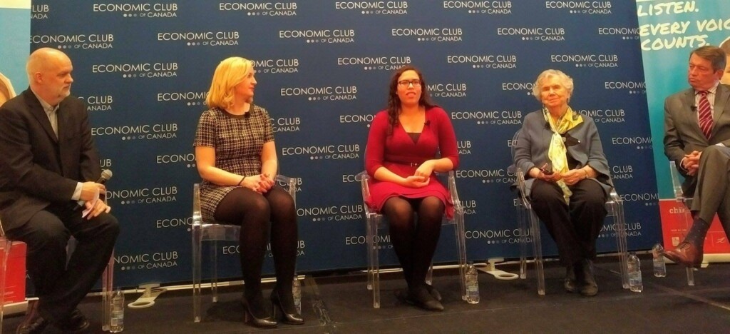 Landon Pearson sits on a panel at teh Economic Club of Canada.