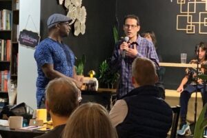 Image of Philip Kaisary speaking to an audience at the event.