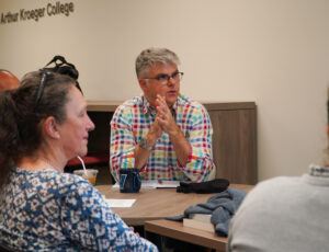 James Milner leads the Q&A discussion.