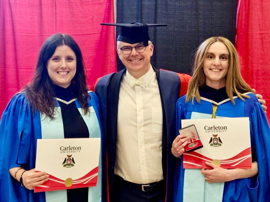 PhD. Graduates Amanda Klassen and Rachel McNally with their PhD supervisor, James Milner on 8 June 2026.