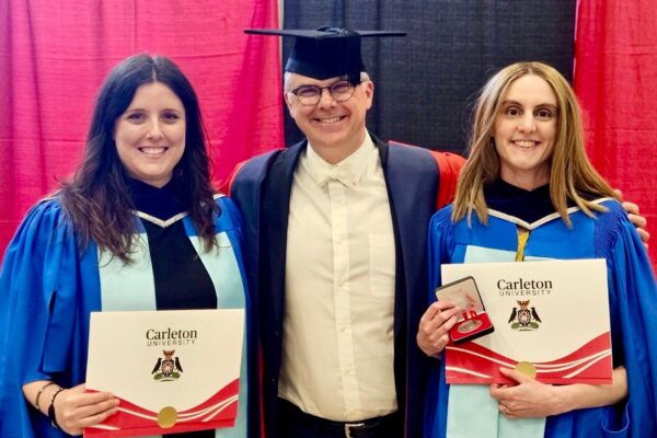 PhD. Graduates Amanda Klassen and Rachel McNally with their PhD supervisor, James Milner at the Carleton University convocation ceremony on 8 June 2026.