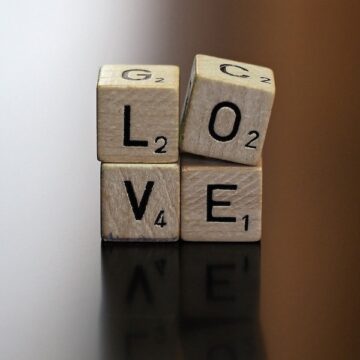 Scrabble pieces that spell the word LOVE