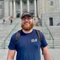 Nick in front of a staircase