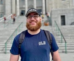 Nick in front of a staircase