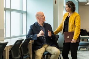 Don and Julie chatting at conference