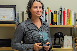 Julie posing with her award.