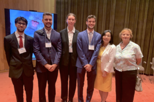 Group of departing JET students standing in a row with Yoko and Elizabeth