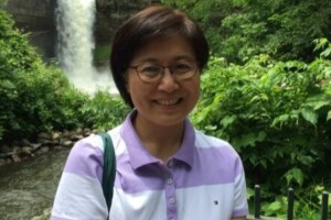 Soyoung in front of a waterfall