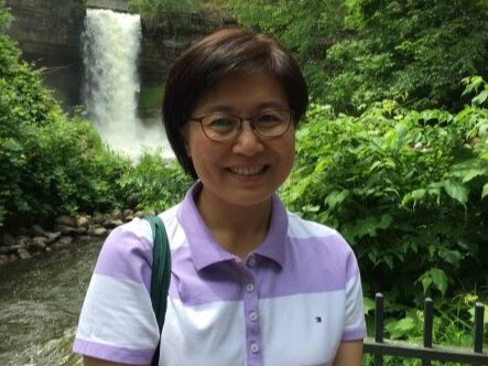 Soyoung in front of a waterfall