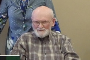 Doug Ellis with his book