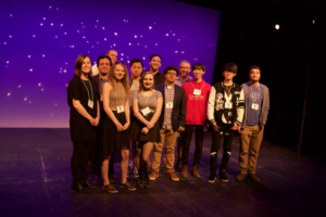 Group of performers on the KM Theatre stage