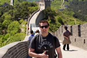 Student giving thumbs up on Great Wall of China