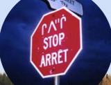 Innu/Stop/Arret sign