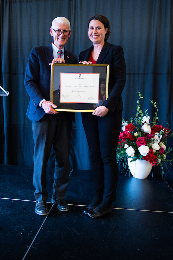 Julie receives award from Jerry Tomberlin