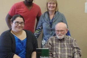 Research team with the book