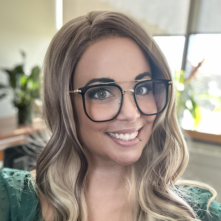 Lindsay smiles at the camera