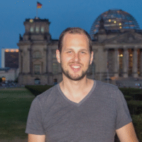 Adam standing in front of Bundestag in the evening