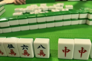 Mahjong tiles on a green surface