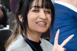 Mala giving the peace sign