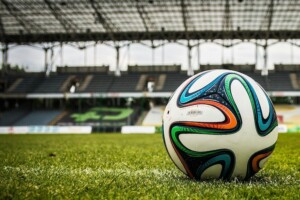 Soccer ball on grass in a stadium