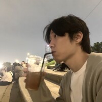 Seungjun drinking a bubble tea at an evening sports event