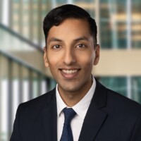 Jabir in a suit and tie.