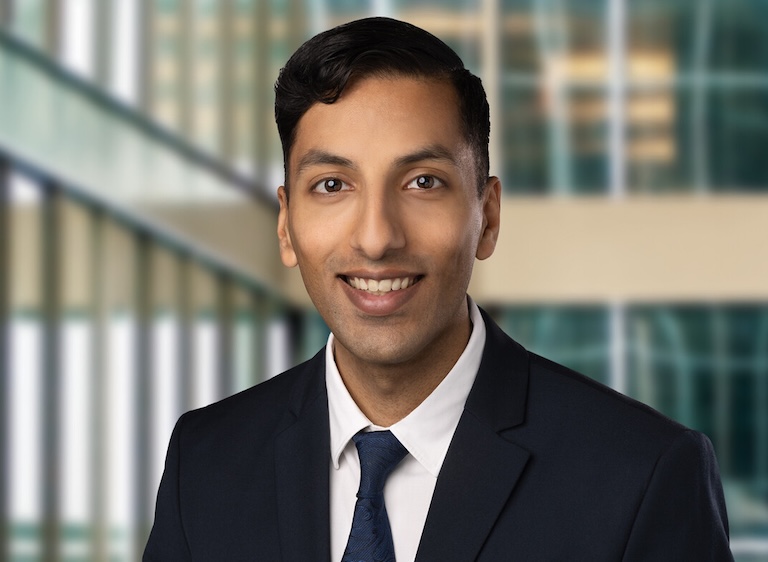 Jabir in a suit and tie.