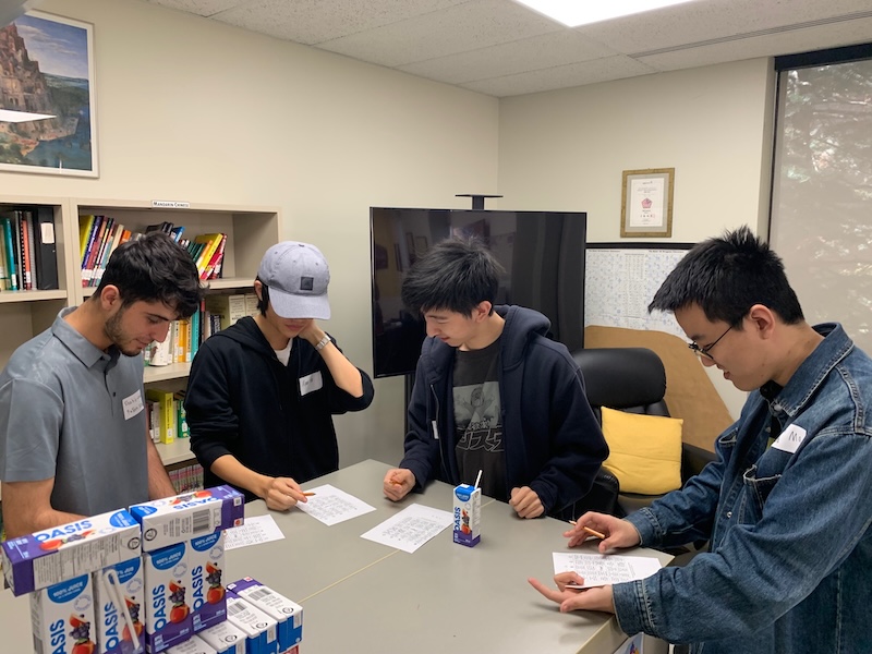 Four learners puzzle over clues