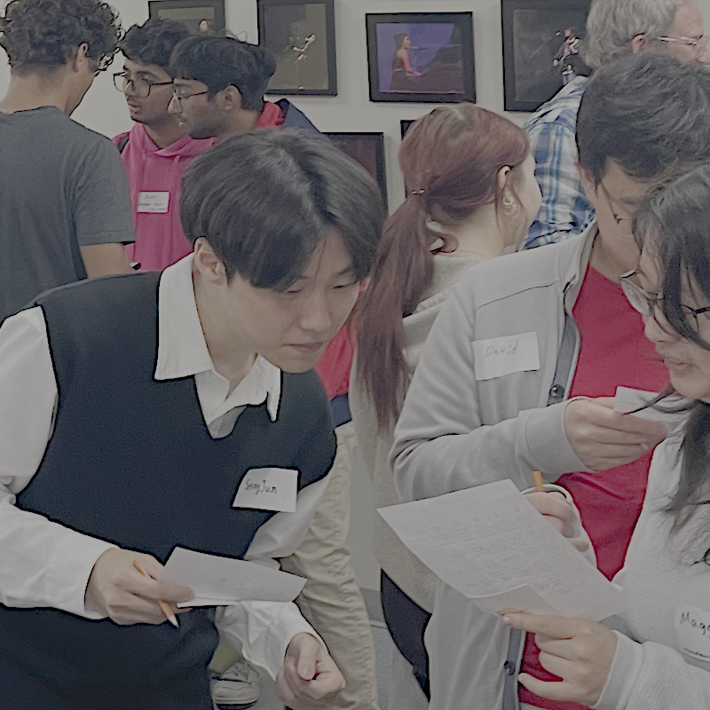 Seungjun, David, and Maggie work on their answers.