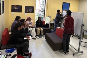 Group of students looking attentively at the whiteboard