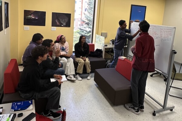 Group of students looking attentively at the whiteboard