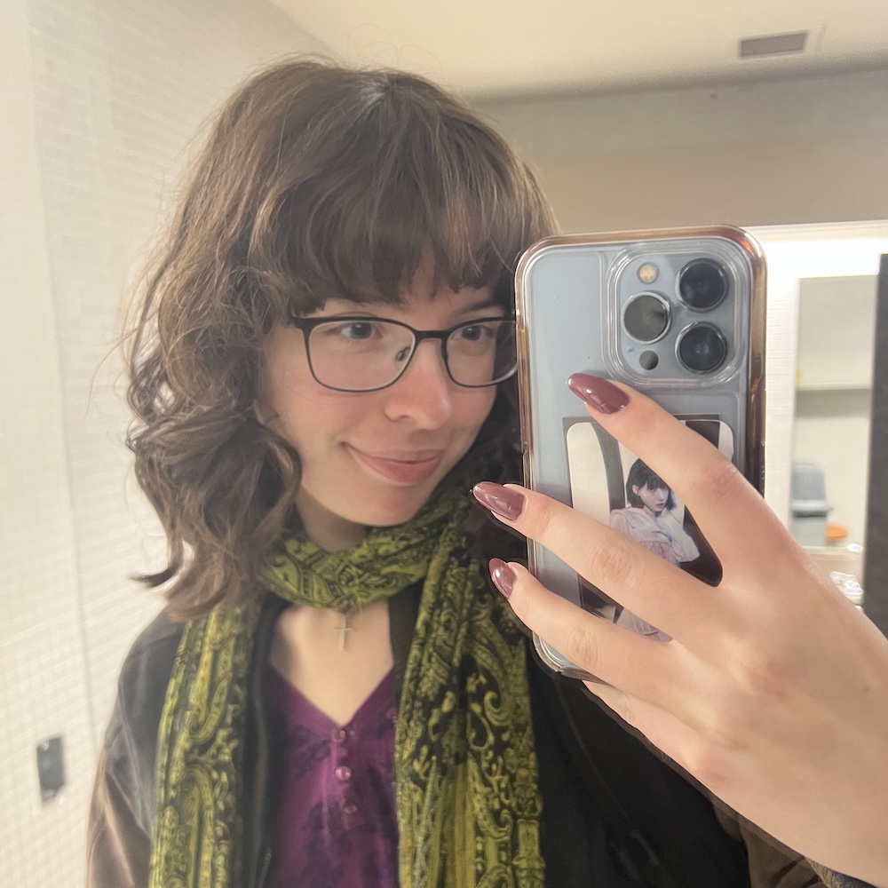 Margo smiles for her phone