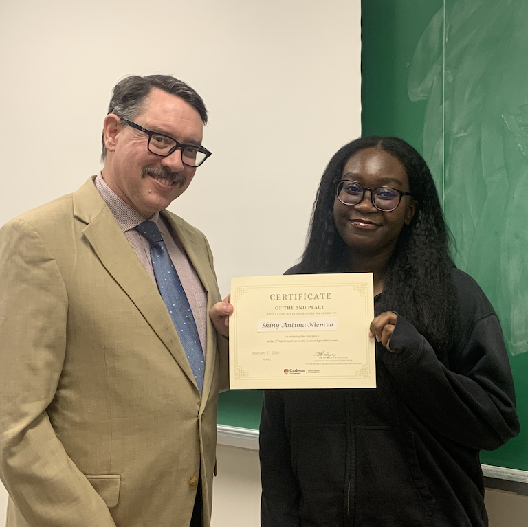 Shiny receives certificate from Michael Rodgers.