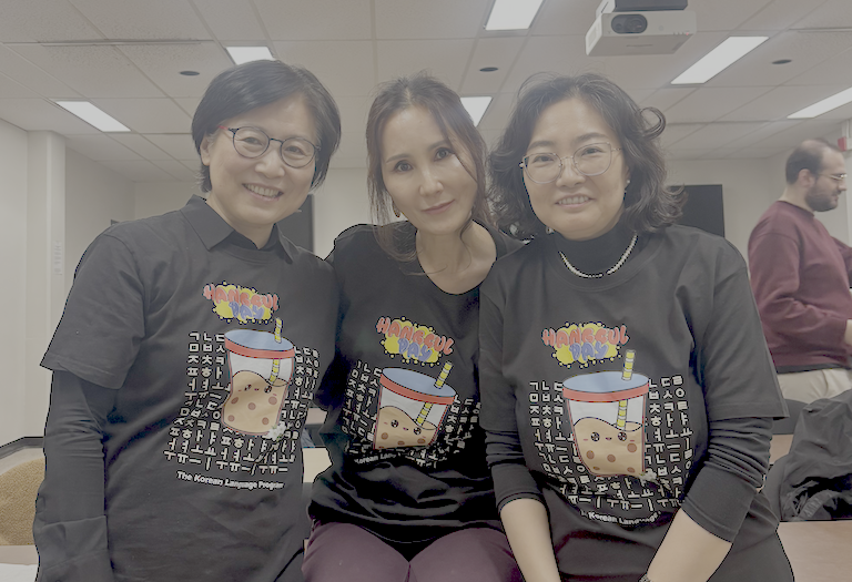 Soyoung Kang, HyounJeong Yoo, and Seunghee Chung pose for a photo in their Hangeul Day teeshirts.