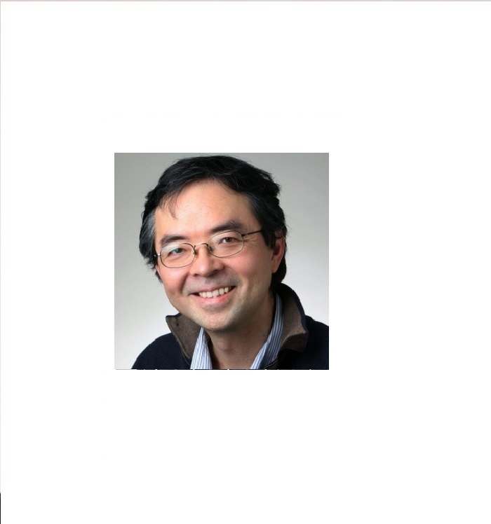 A middle-aged Asian Canadian man wearing glasses and smiling